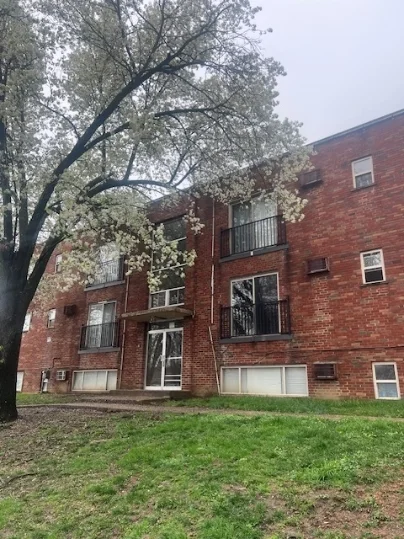 Statham Cove brick building with mature landscaping